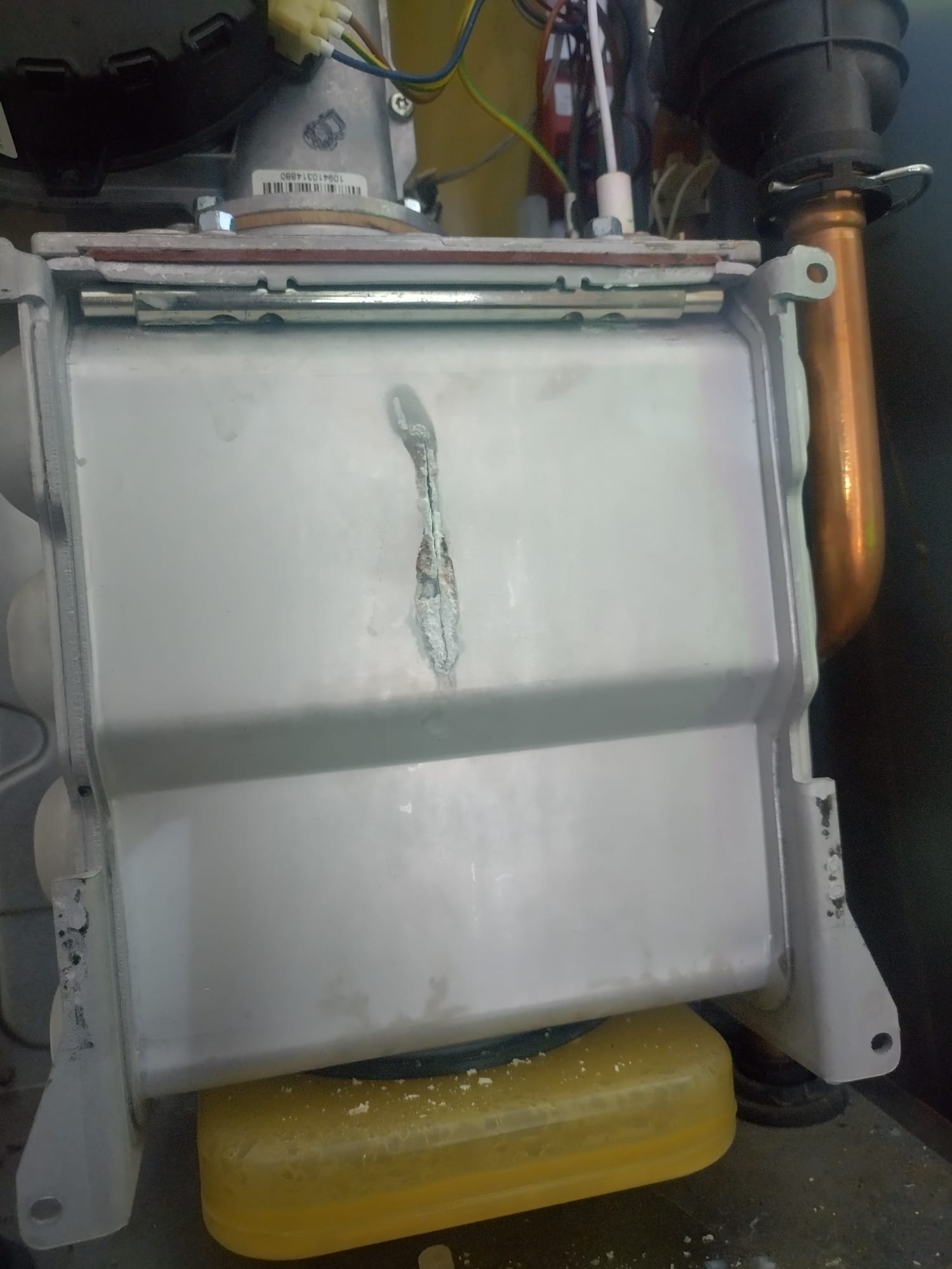 Cracked boiler heat exchanger found during emergency call-out in West Yorkshire — combustion gases leaking into property